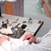 The manual sewing of a custom product is performed to exact tolerances
